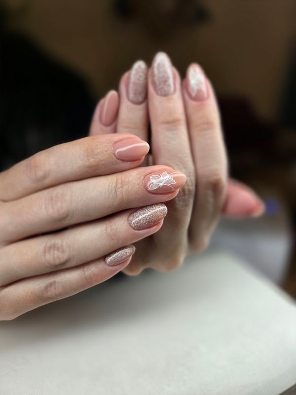 Nude manicure with glitter accent nail