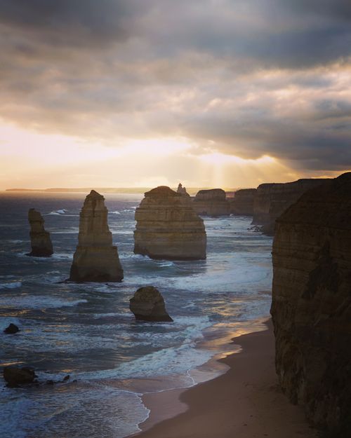 Free Dramatic sunset over the iconic Twelve Apostles along Australia's Great Ocean Road. Stock Photo