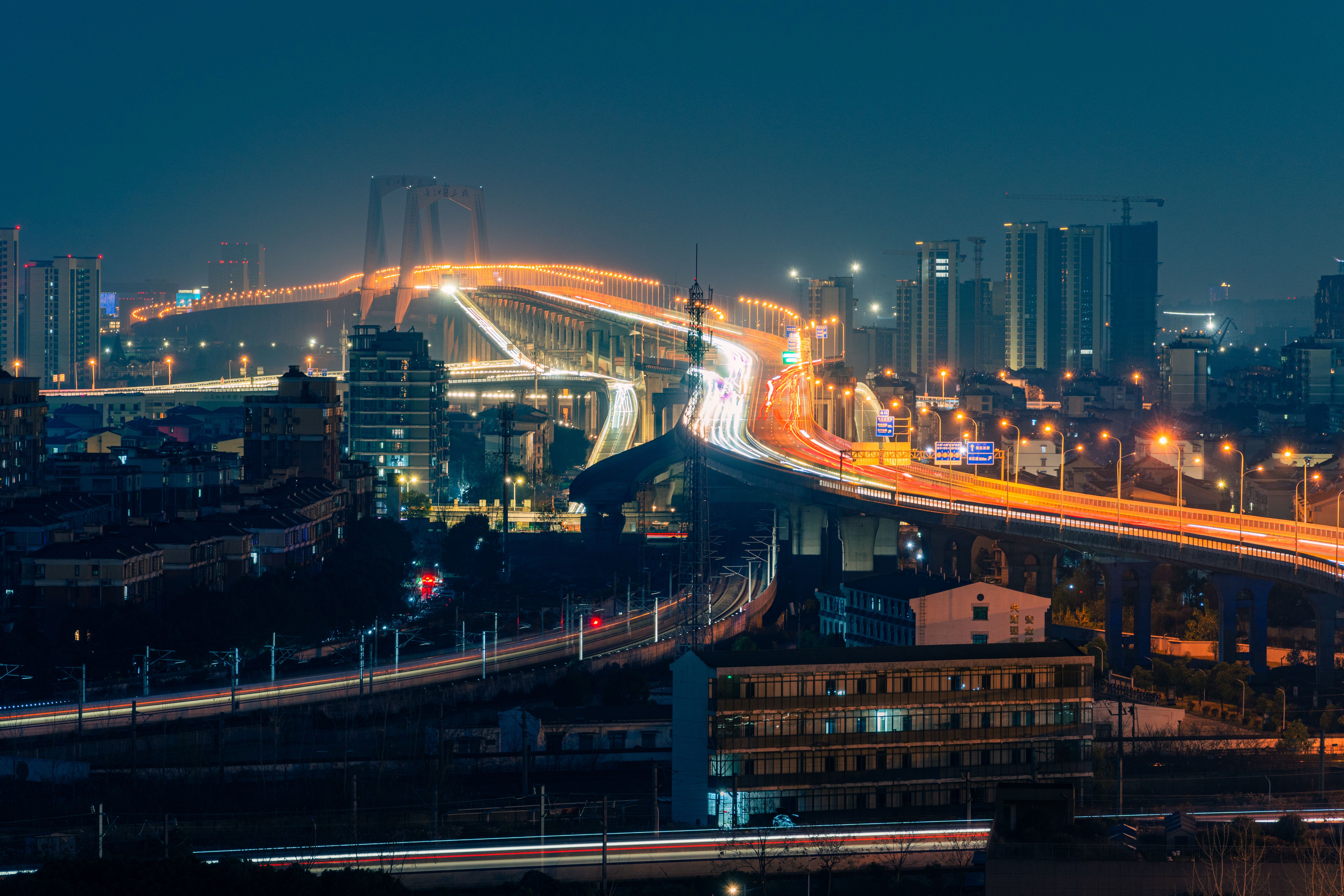 City Nightscape with Illuminated Bridge · Free Stock Photo
