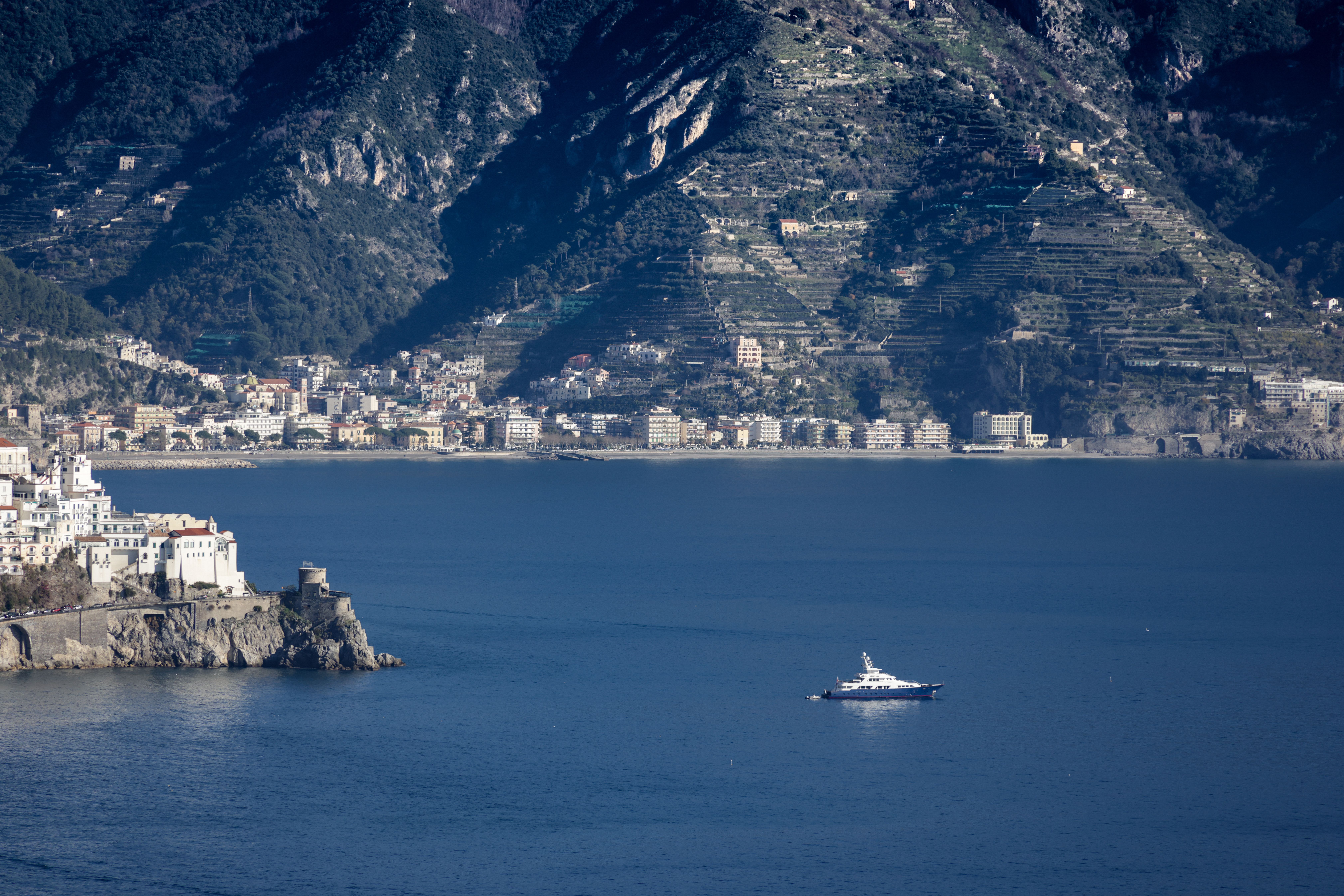 Stunning Full Day Amalfi Coast VIP Yacht Excursion from Rome by Train Review 2026 - Yacht sailing near the picturesque Amalfi Coast, showcasing Mediterranean charm.