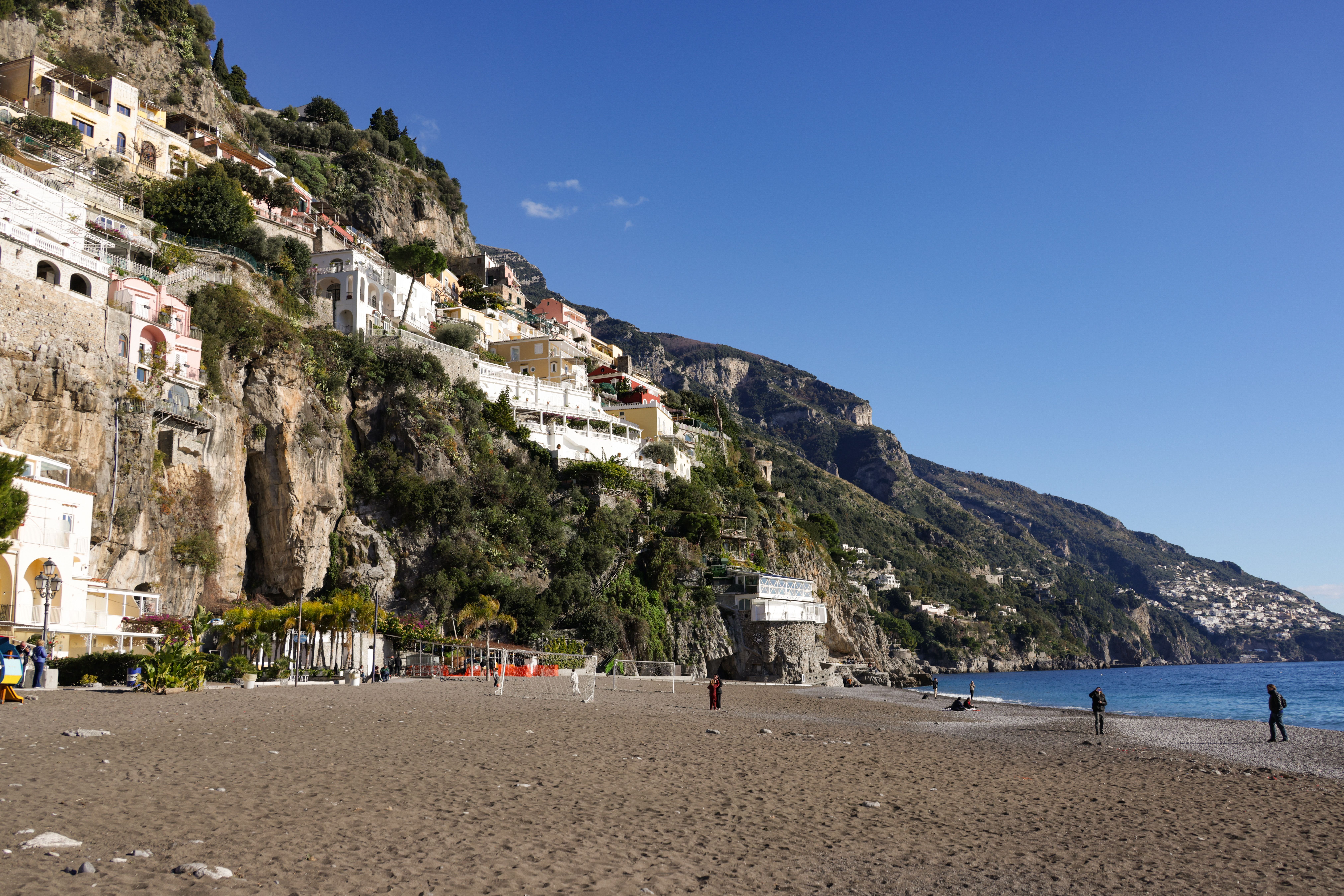 Scenic view of Amalfi Coast with Mediterranean architecture and beach.