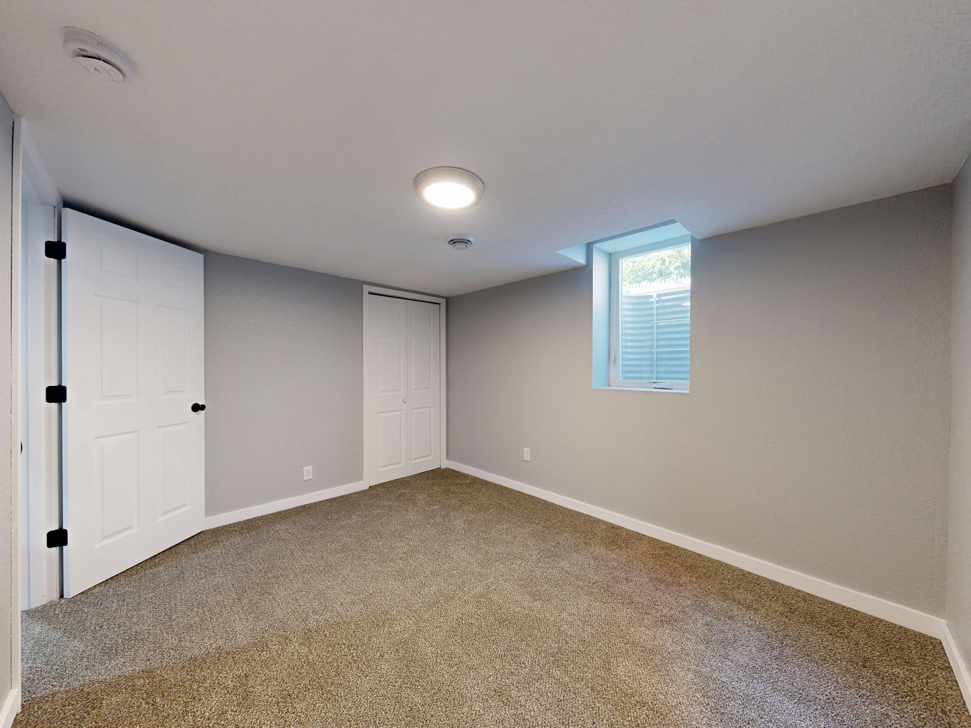 Painters & Decorators in Elmstead, London — professional decorator painting a wall with a roller