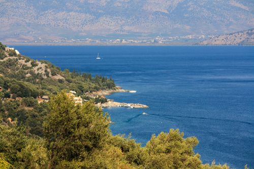 Free Breathtaking coastal landscape of Corfu, Greece with blue waters and lush greenery. Stock Photo