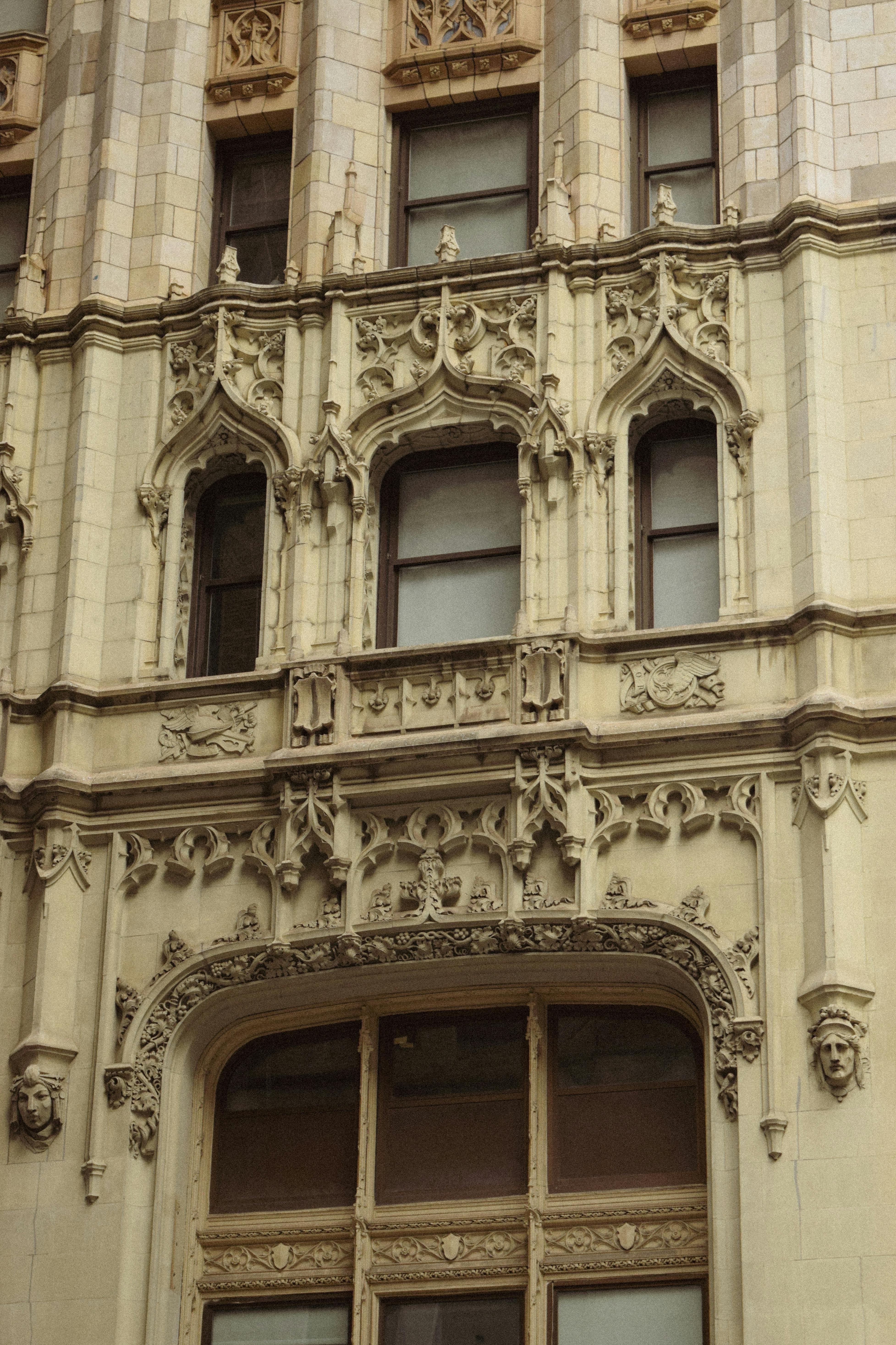 Free Detailed view of Gothic Revival architecture on a historical building facade in New York City. Stock Photo