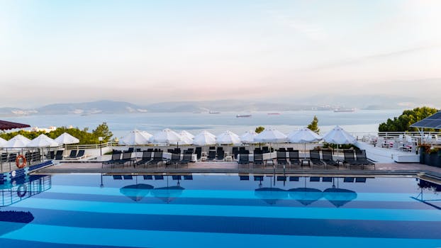 Stunning poolside view overlooking the sea and mountains in Bodrum, Türkiye.