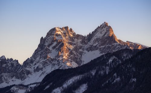 Free Stunning view of snow-covered Dolomites during sunset, capturing the serene beauty of winter mountains. Stock Photo