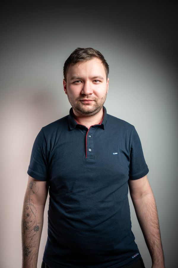 Professional studio headshot on gradient background