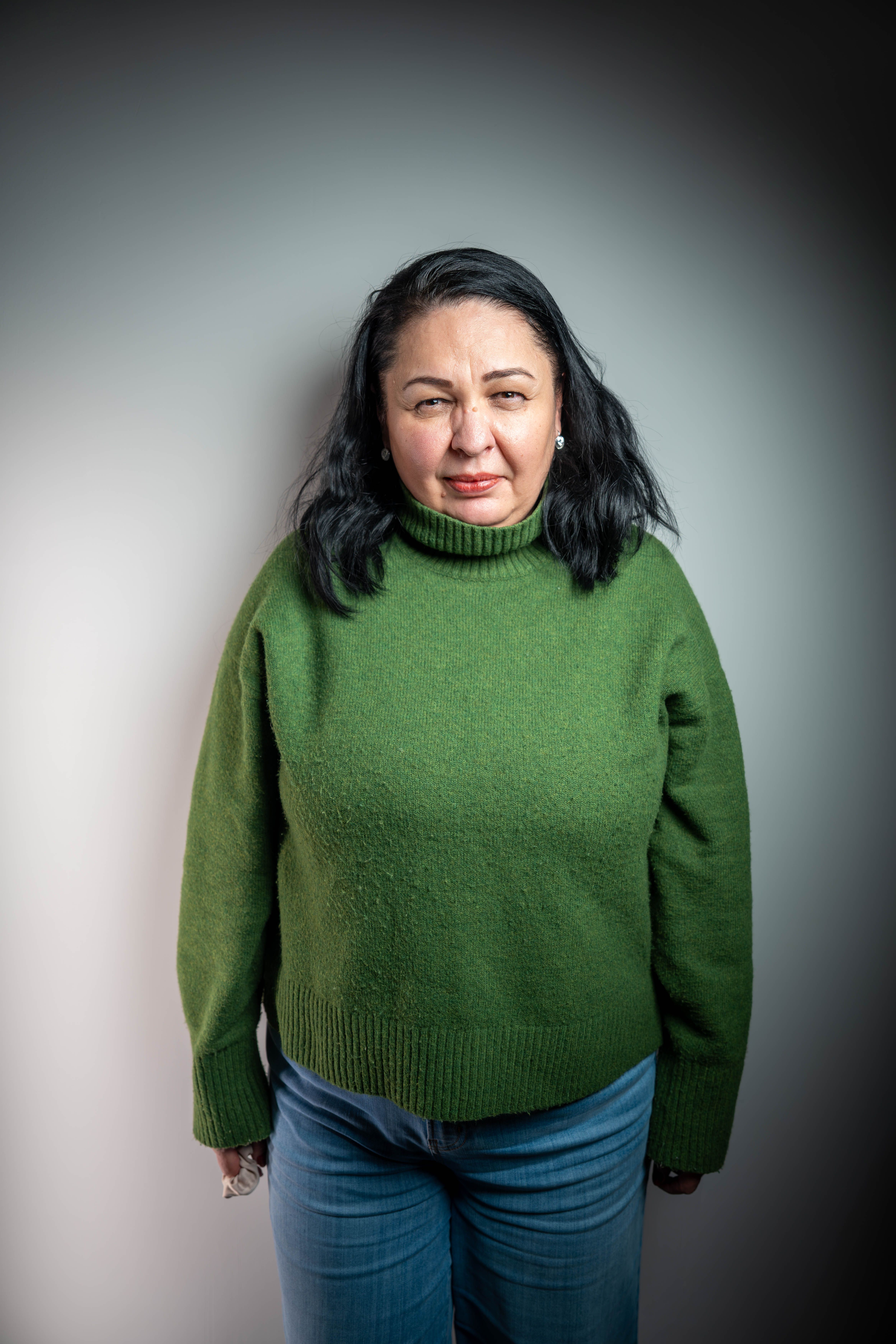 Studio Portrait of Woman in Green Sweater · Free Stock Photo