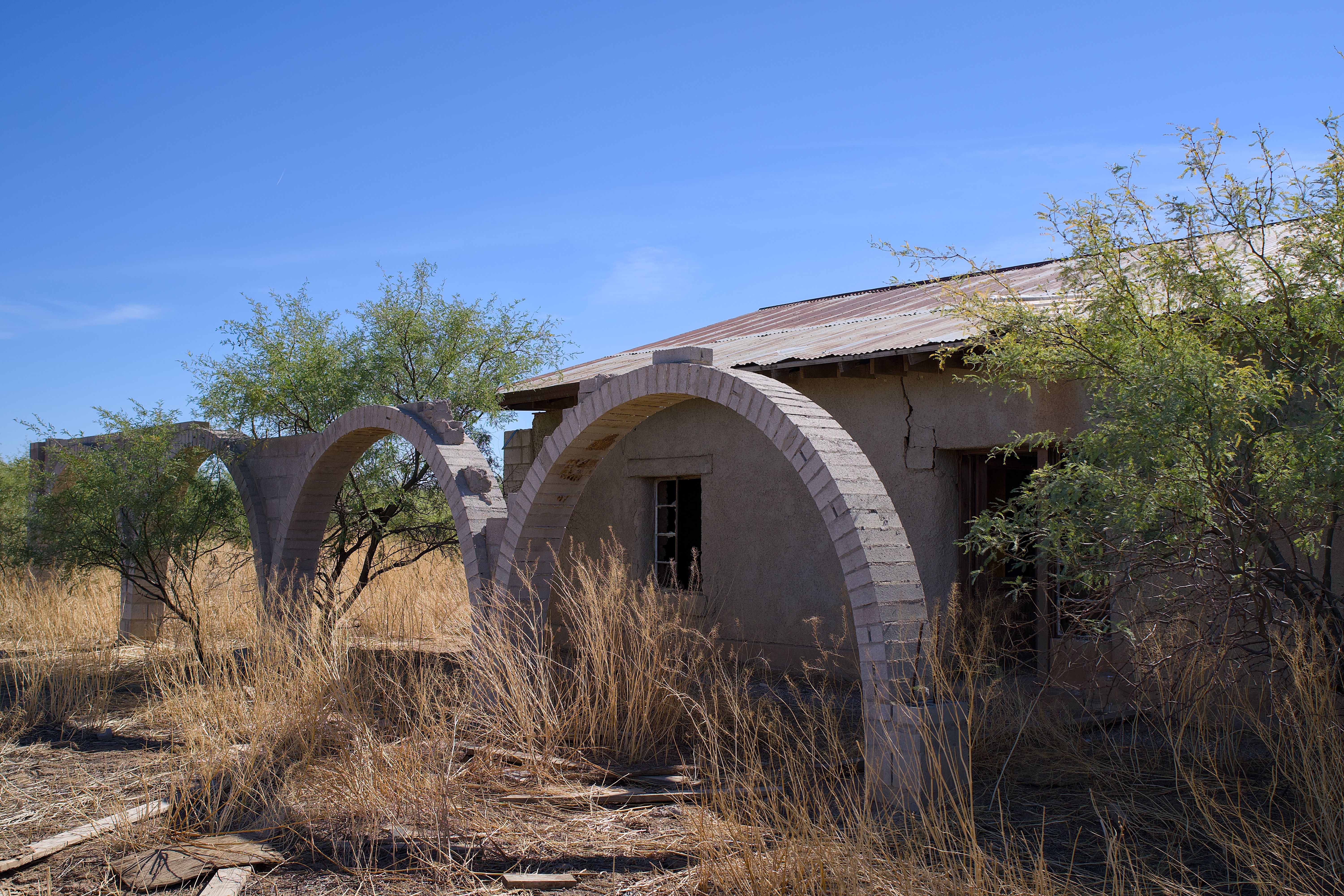 A quiet residential block of desert homes with mountains in the background, representing the growing supply of Las Vegas metro listings in August 2026