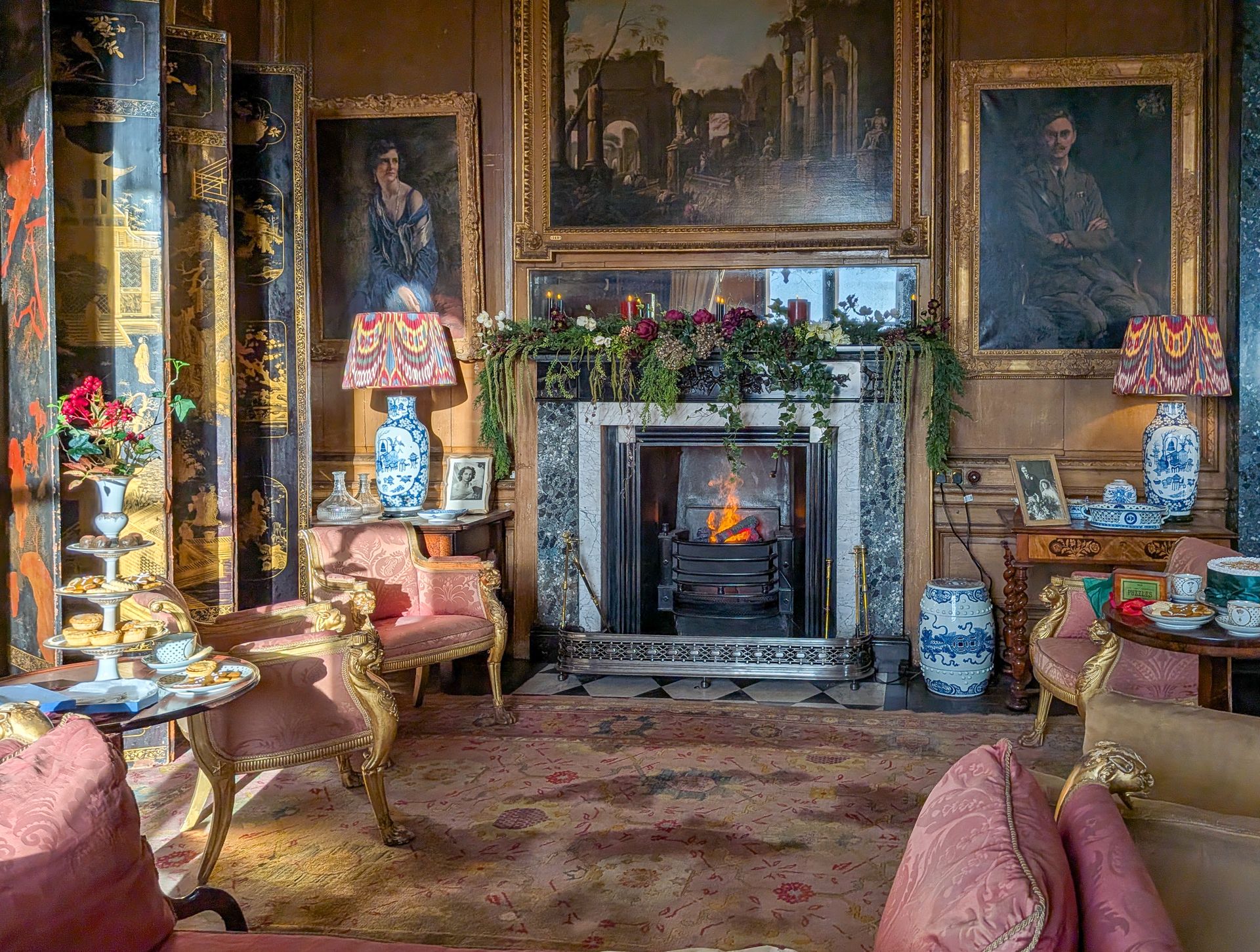 Opulent living room designed by De Legacy, with a fireplace and curated furnishings