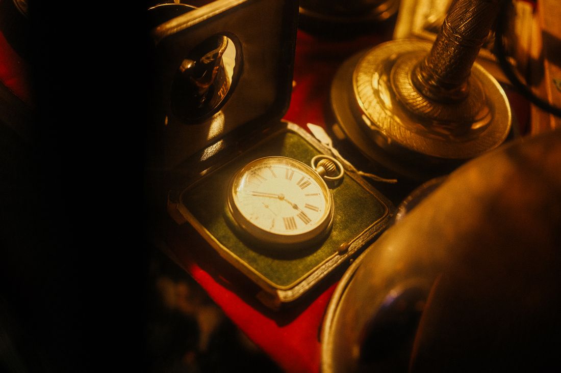 An antique pocket watch in warm amber light — photo by atelierbyvineeth on Pexels