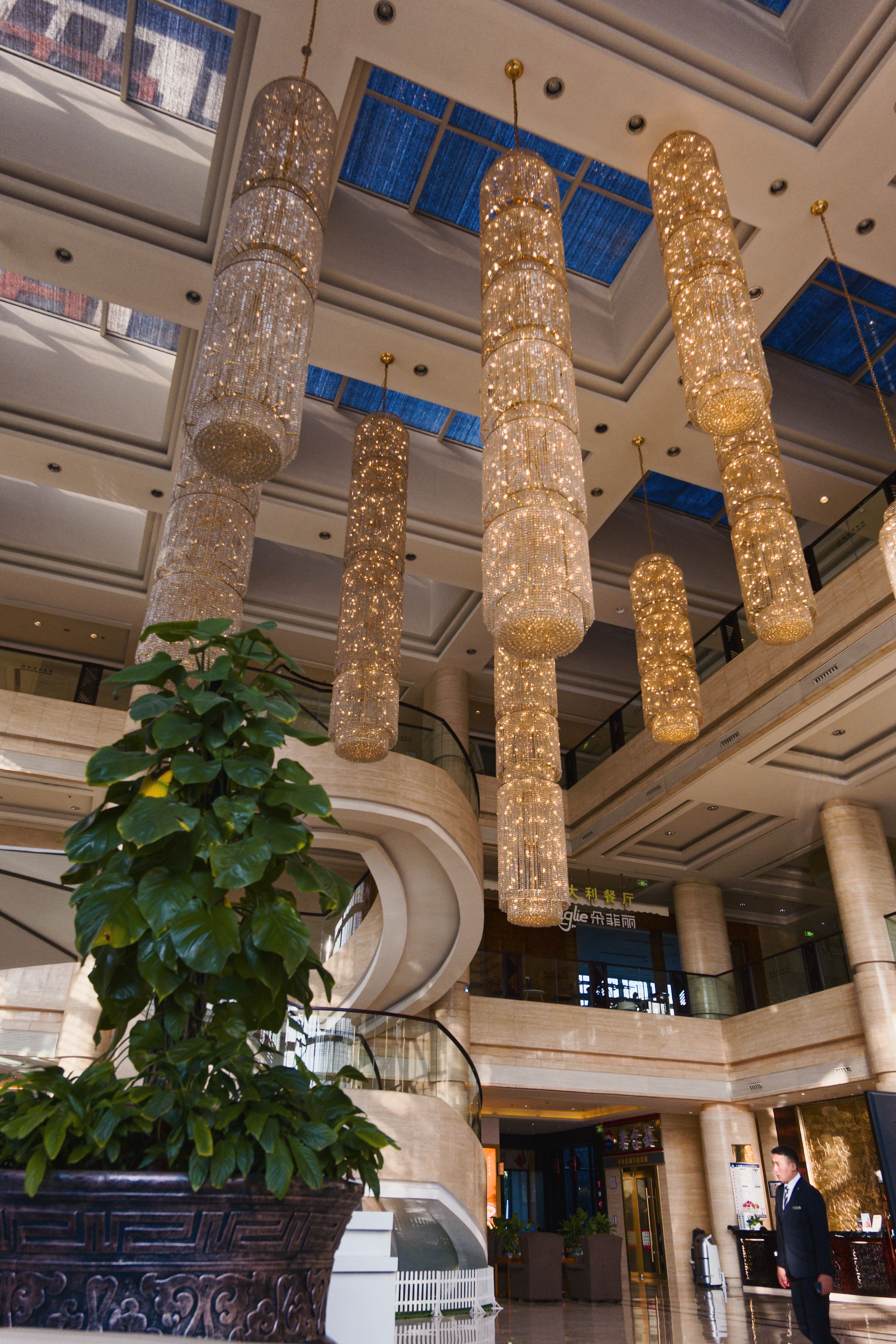 Luxurious hotel lobby with elegant chandeliers and seating