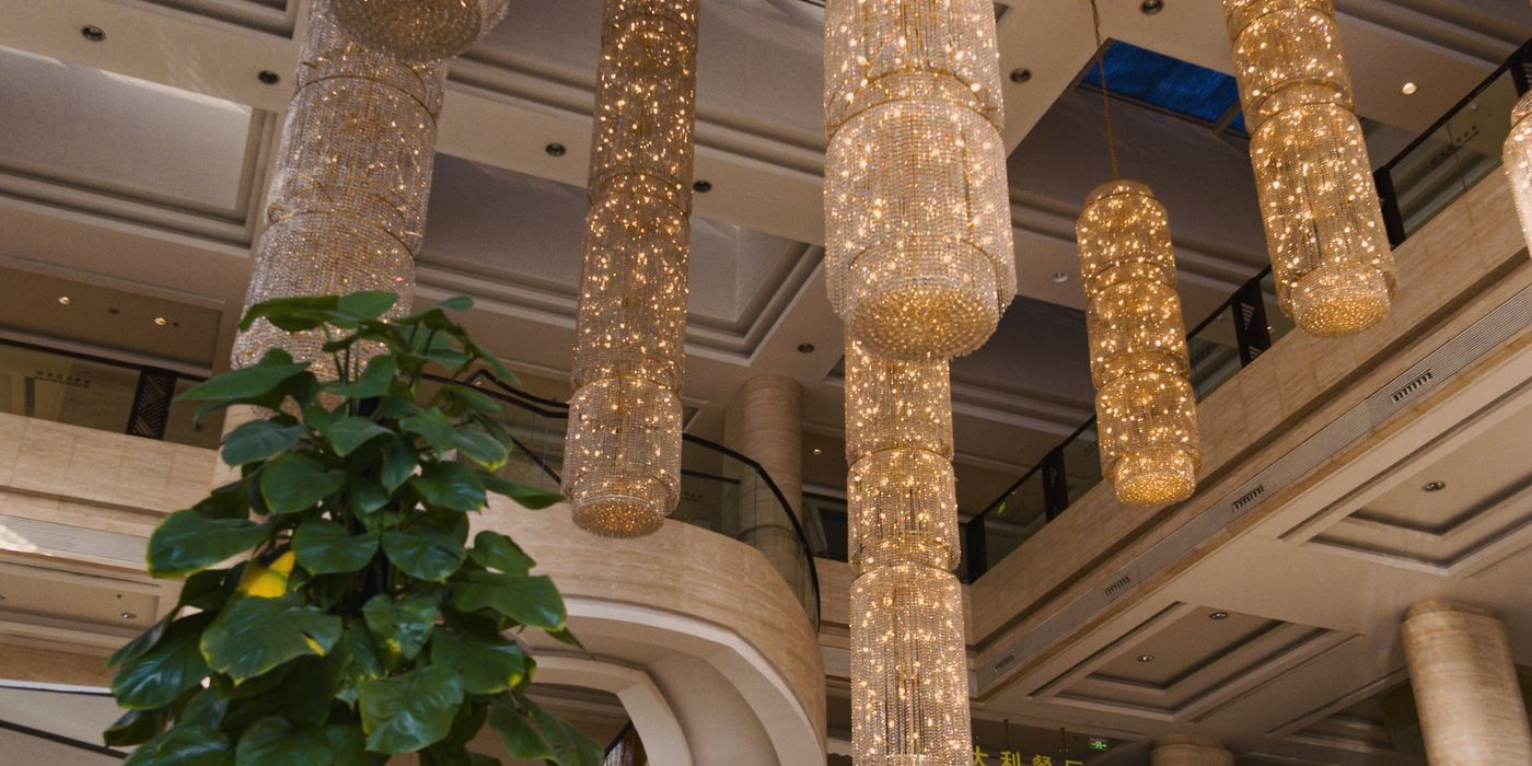 Luxurious hotel lobby with elegant chandeliers and seating