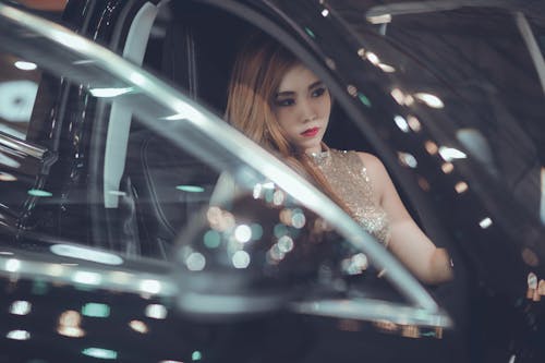 Woman Sitting Inside Black Vehicle