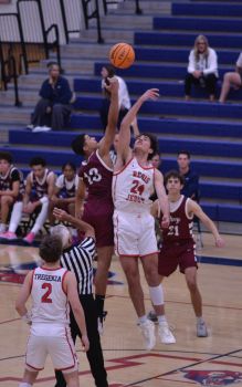 Exciting tip-off action during a high school basketball game in Gilbert, Arizona.