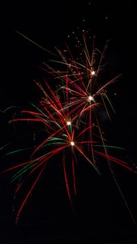 Vibrant fireworks burst against a dark night sky in West Java, Indonesia.