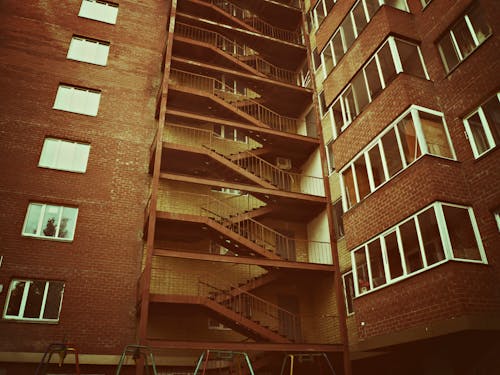 Free stock photo of apartment building, red bricks, stairs Stock Photo