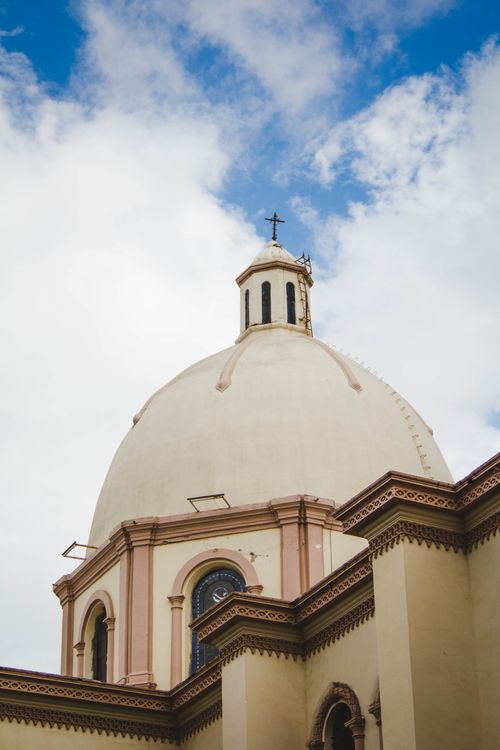 Free Photo of Catedral de Culiacán's dome under a bright blue sky. Iconic Sinaloa architecture. Stock Photo