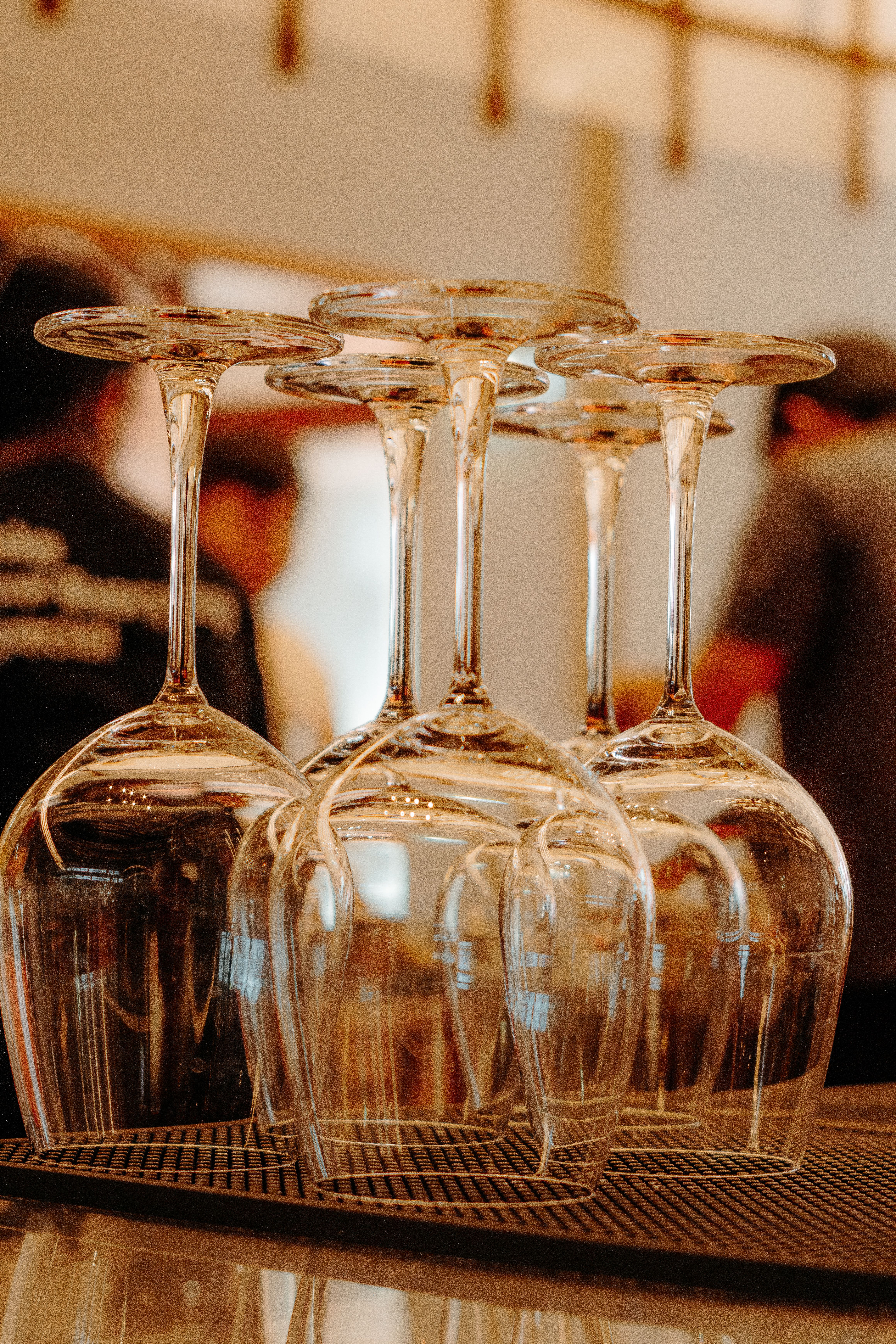 Close-Up of Upside-Down Wine Glasses in Bar  Free Stock Photo