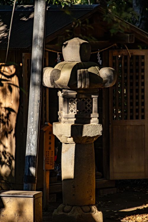 Free Captivating view of a traditional stone lantern in a serene shrine setting in Kawagoe, Japan. Stock Photo