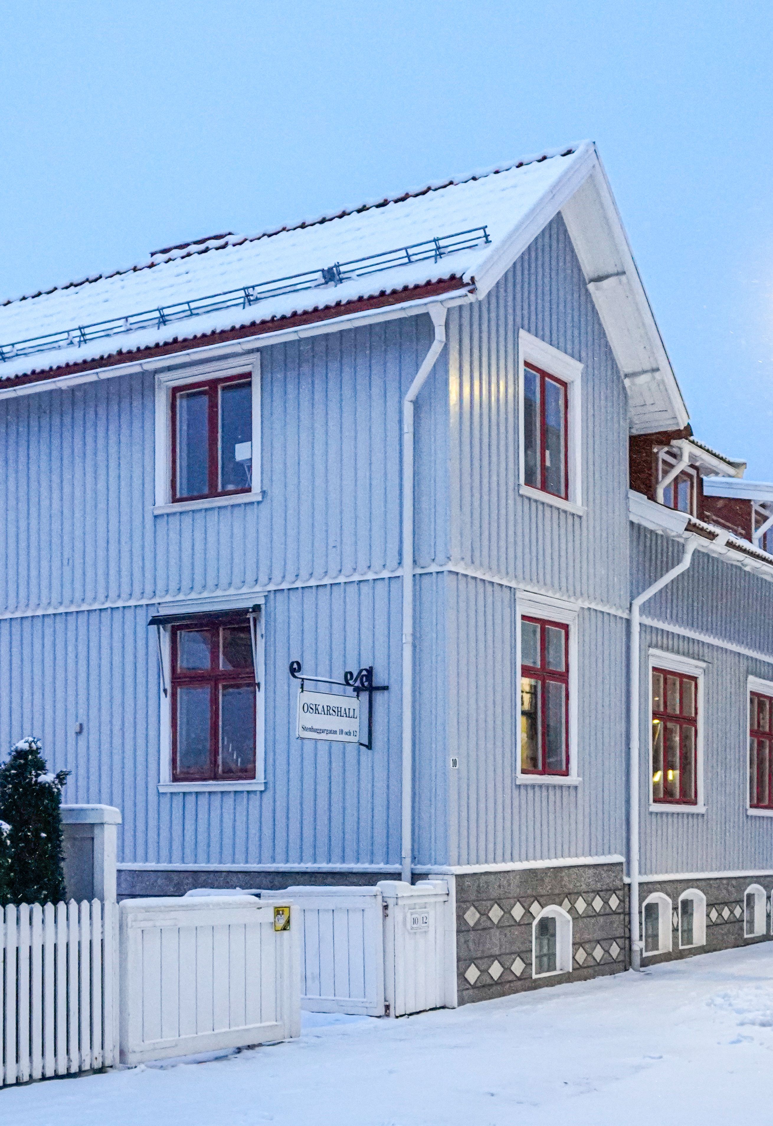 Charming snow-covered wooden Swedish house in Jönköping during winter.