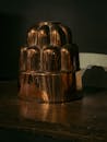 Antique Copper Mold on Wooden Table