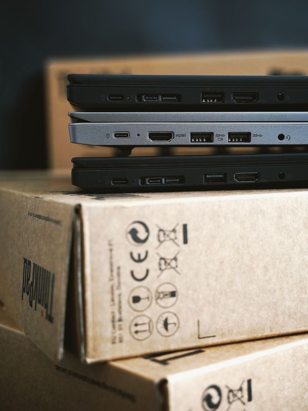 Clean, modern stacked laptops ready for resale