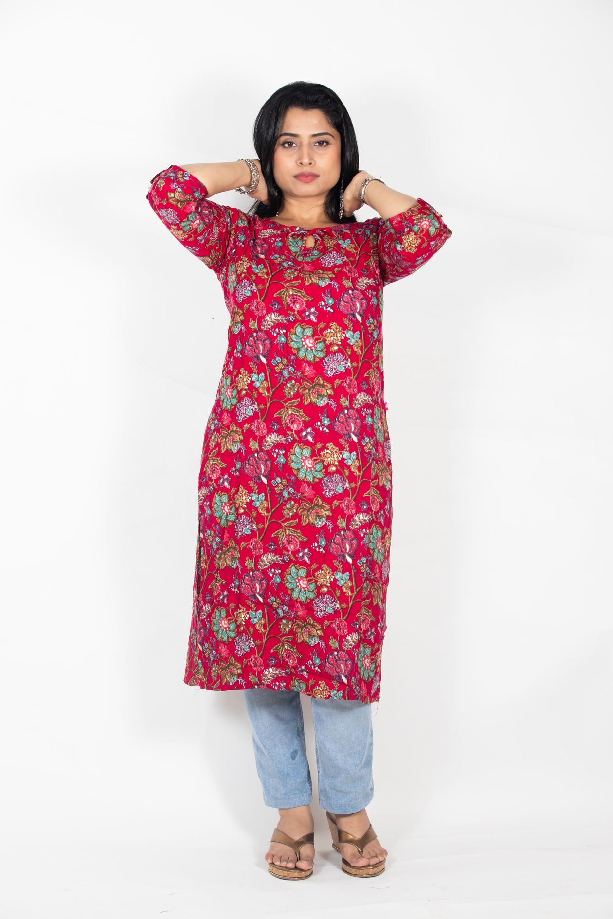 A floral kurta worn with denim and sandals