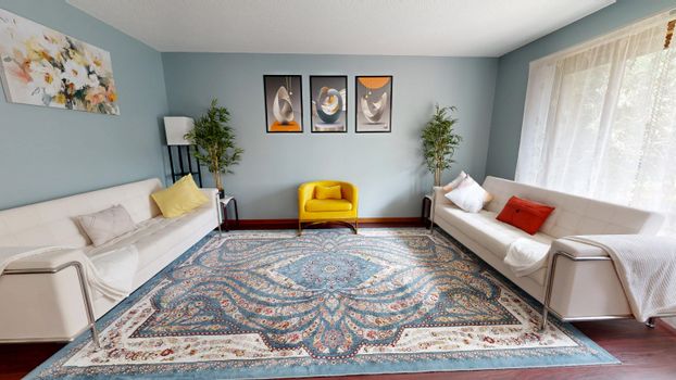 Bright and stylish living room with contemporary furniture and decor.