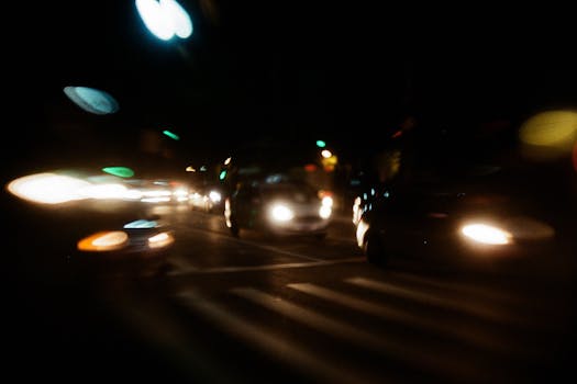 Abstract long exposure photography capturing cars and lights in motion at night.
