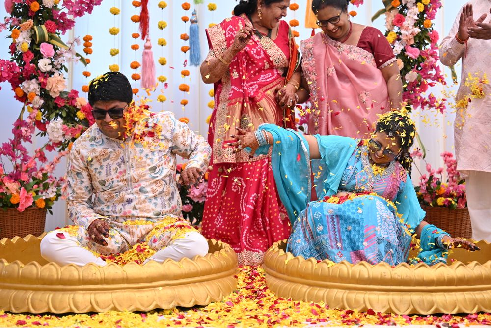 Joyful celebration with vibrant flowers at an Indian ceremony