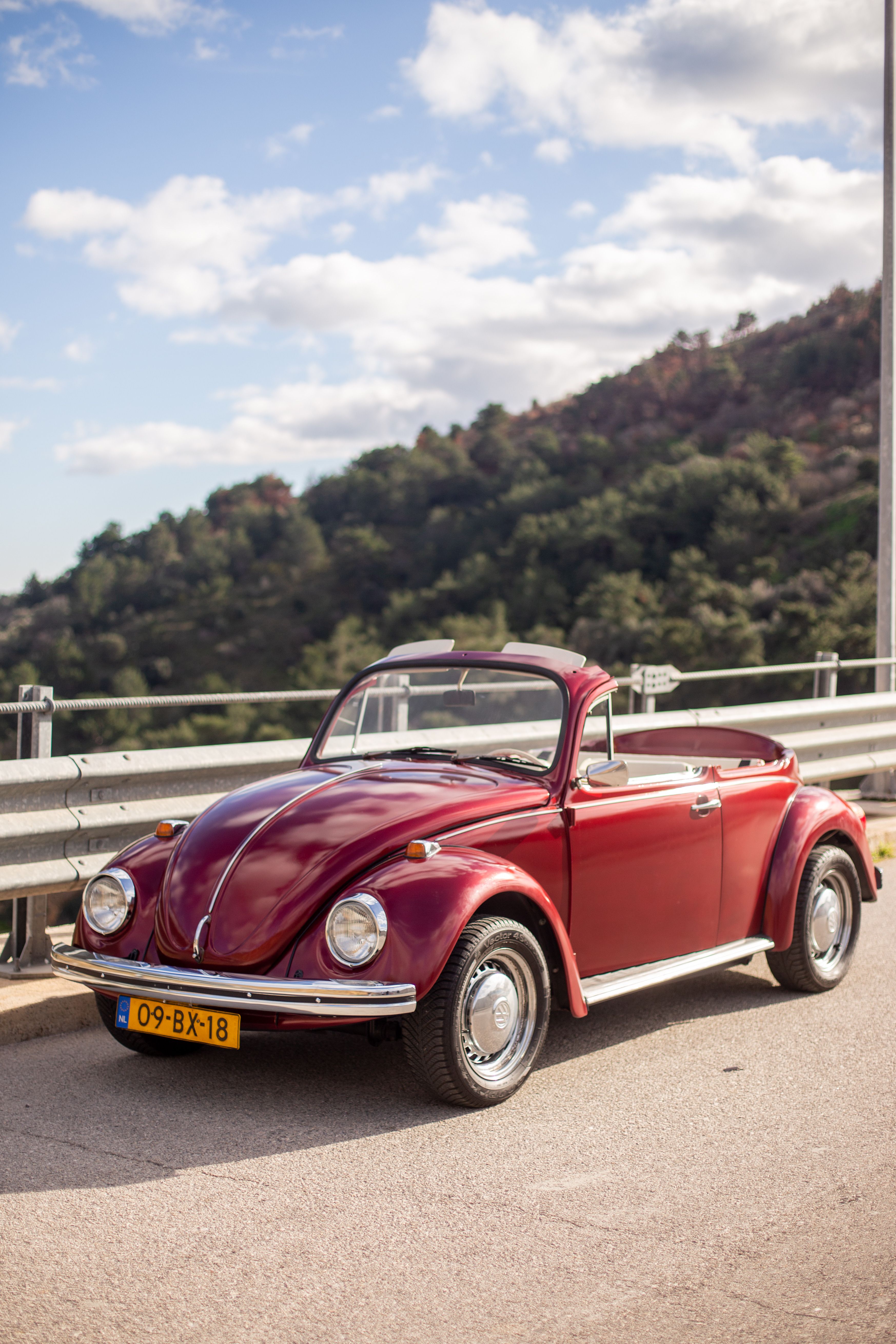 Vintage Red Convertible on Scenic Mountain Road · Free Stock Photo