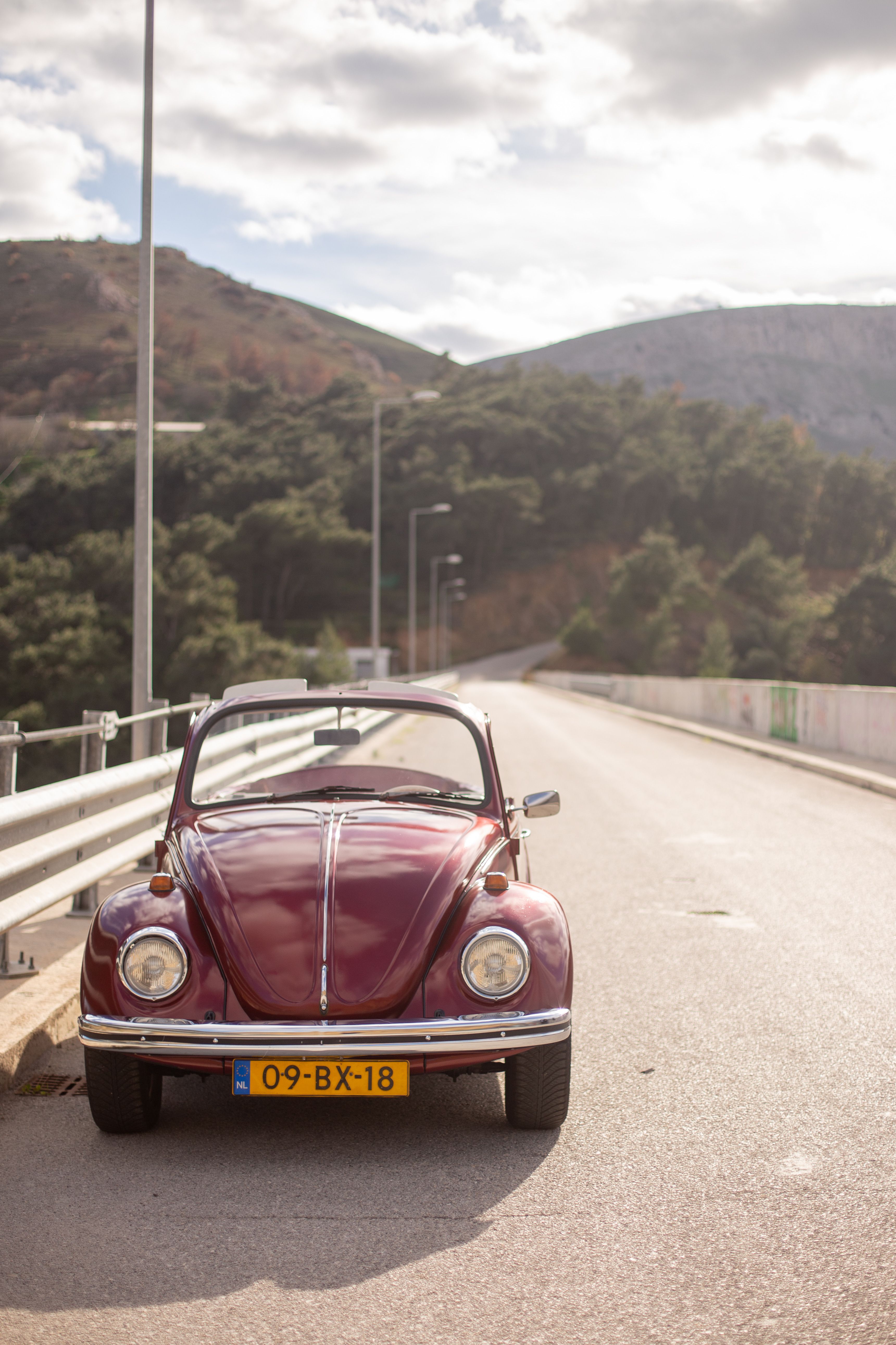 Vintage Red Convertible on a Scenic Mountain Road · Free Stock Photo