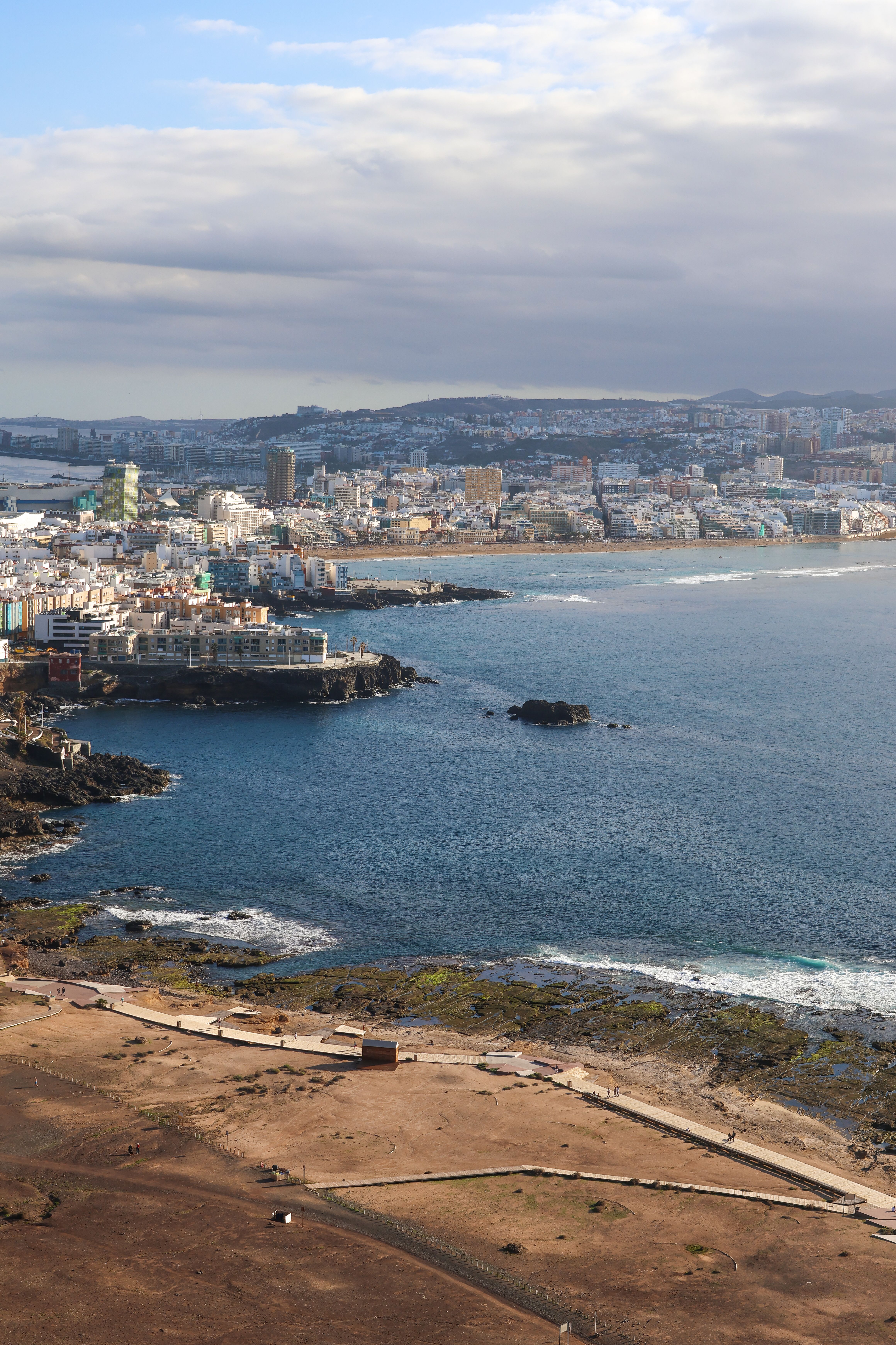 Aerial View of Coastal City with Ocean and Skyline · Free Stock Photo