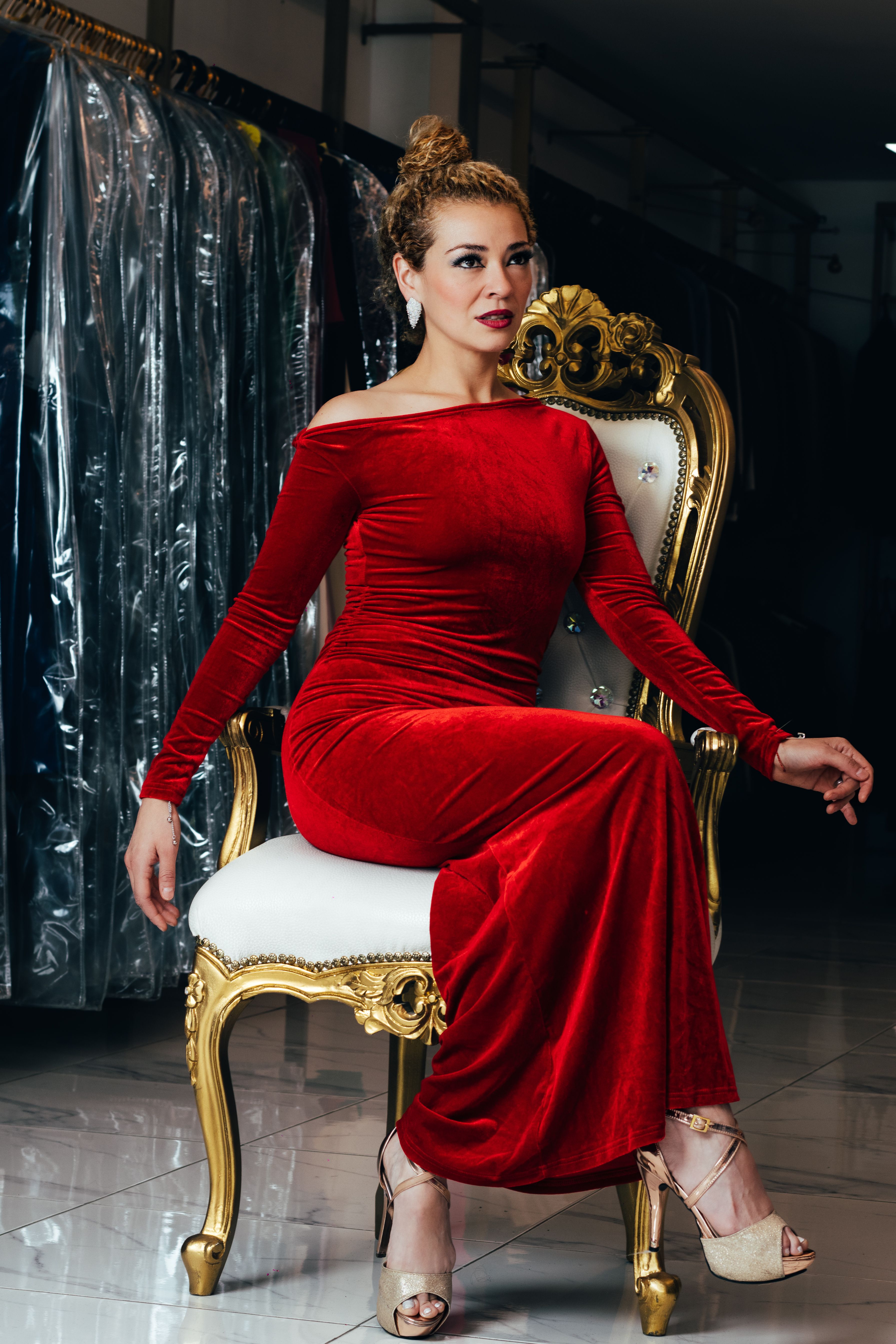 Elegant Woman in Red Velvet Dress on Ornate Chair · Free Stock Photo