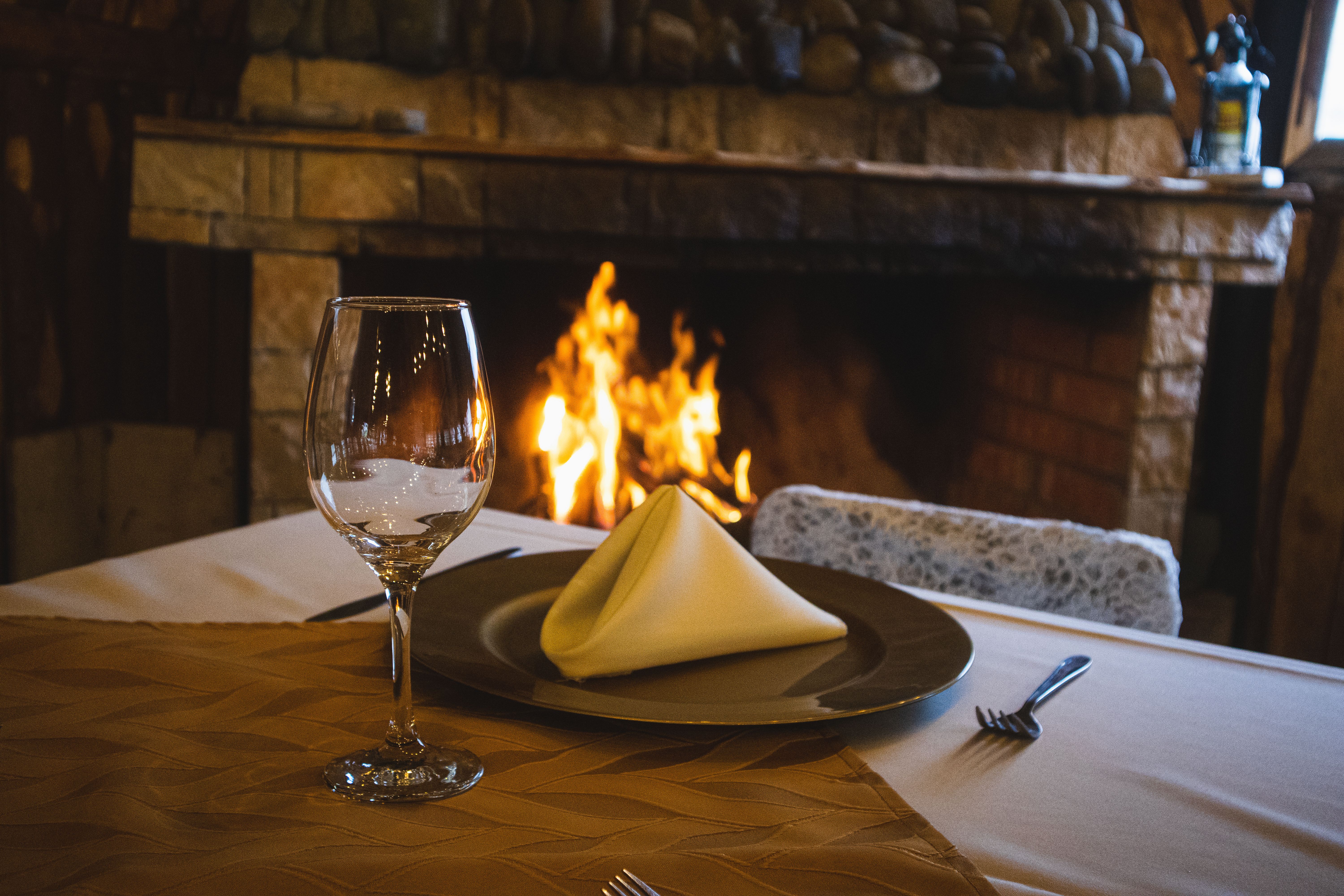 Cozy Fine Dining Setup by Fireplace · Free Stock Photo