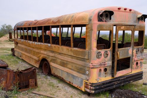 Free Explore a decaying and rusted school bus in the Arizona desert, capturing an urban exploring vibe. Stock Photo