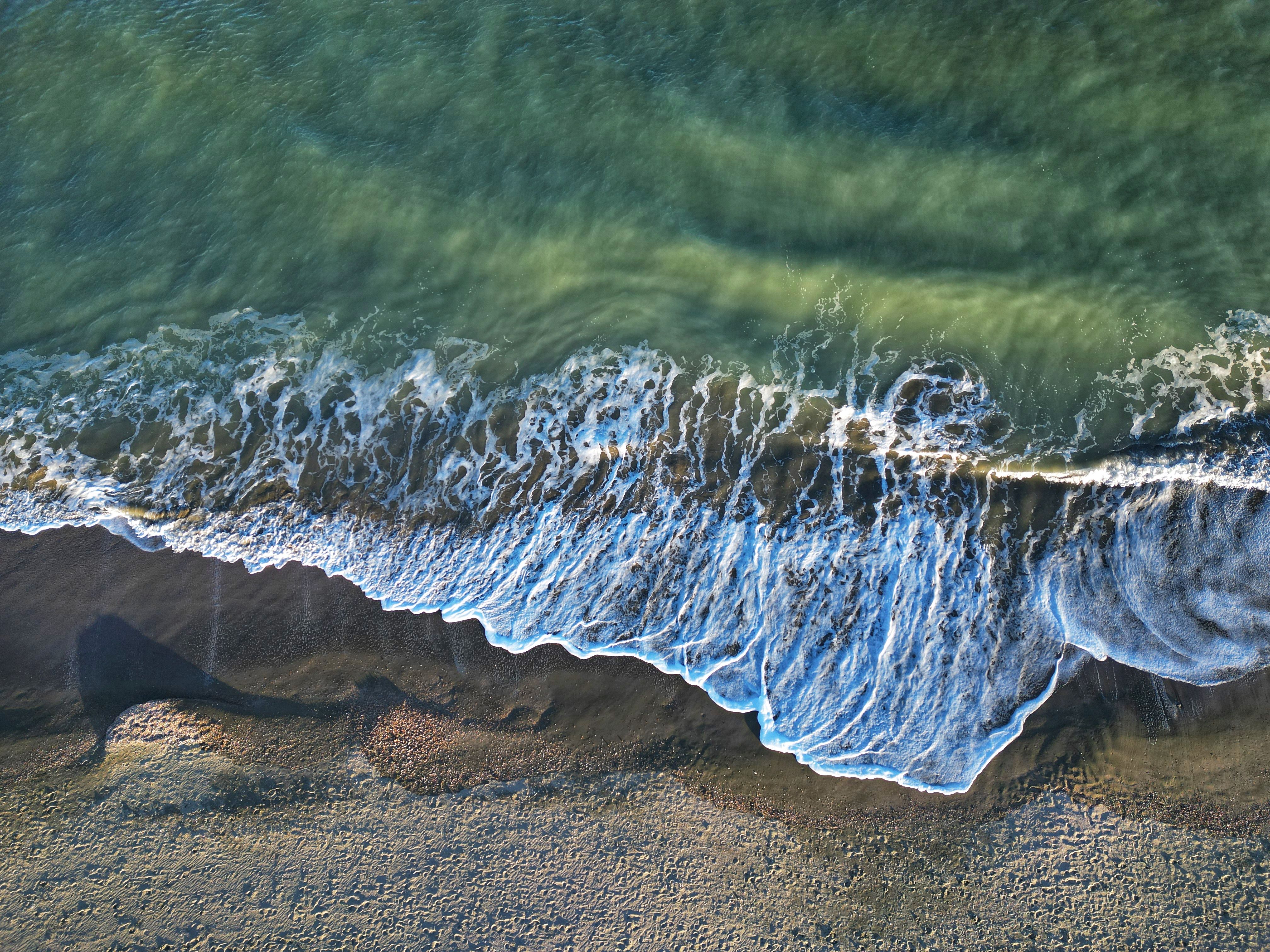 Aerial View of Ocean Waves Crashing on Shore · Free Stock Photo