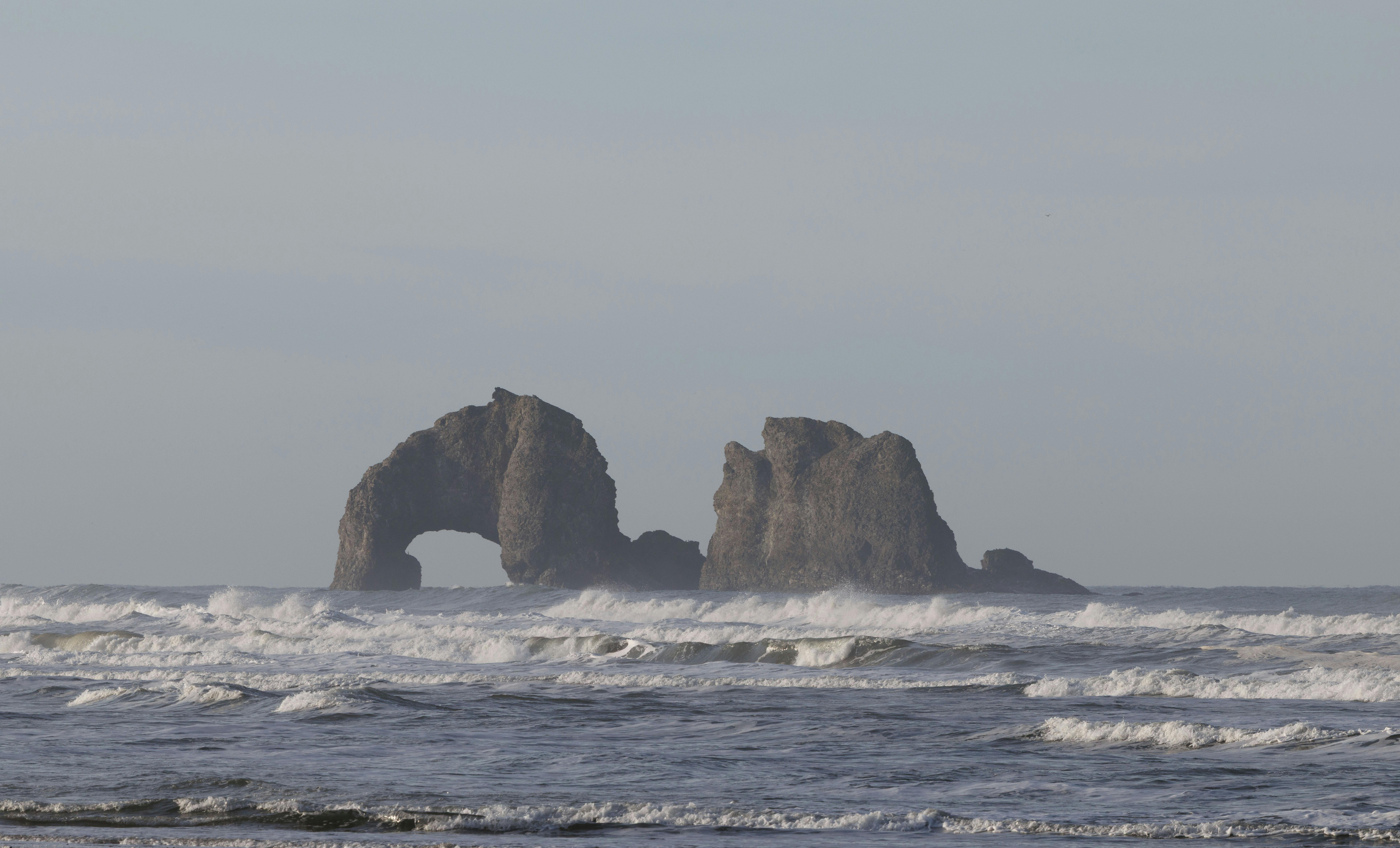 Beautiful coastal rock formations with waves in the Pacific Ocean near Oregon.