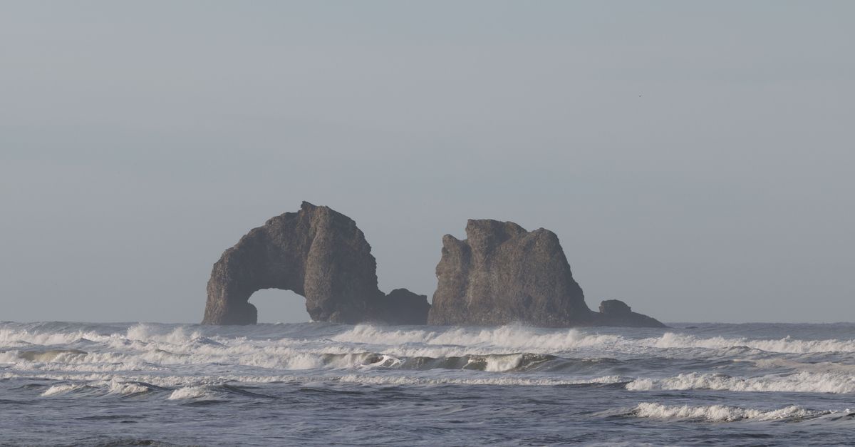 Beautiful coastal rock formations with waves in the Pacific Ocean near Oregon.