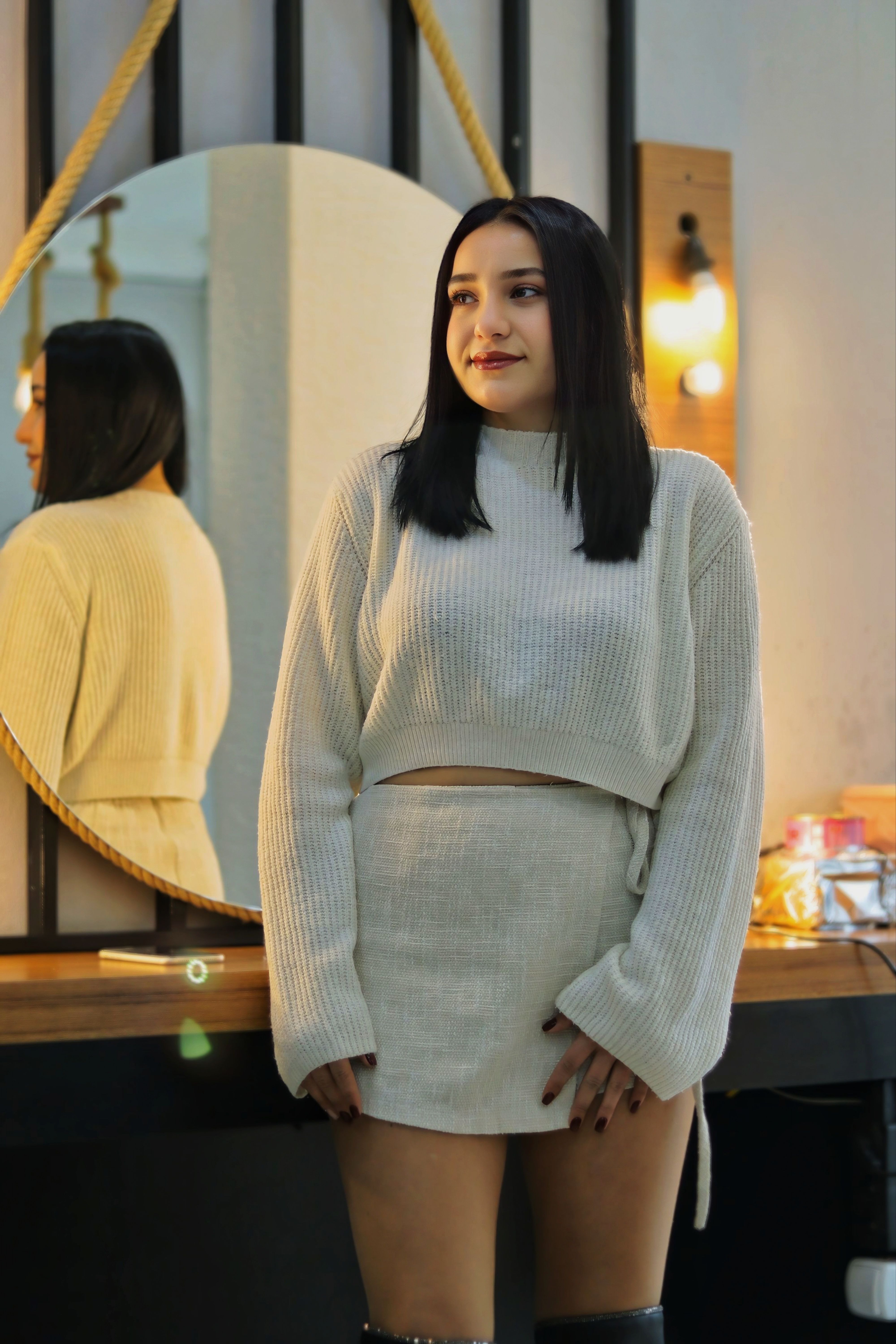 Stylish Woman in Modern Indoor Setting · Free Stock Photo