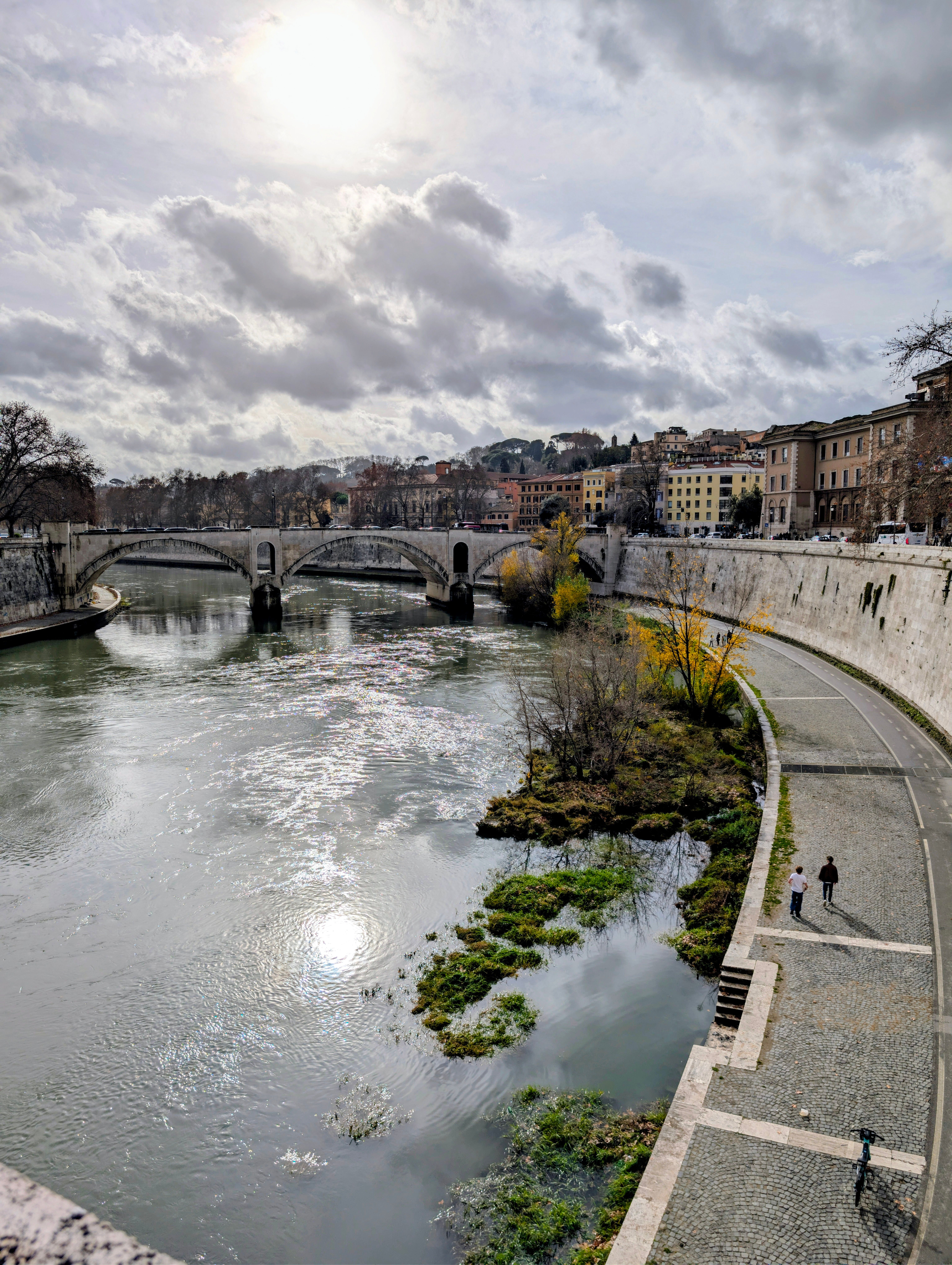 Picturesque Riverside View with Ancient Bridge · Free Stock Photo