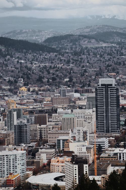 Free From above of developing contemporary city center with modern towers and residential buildings Stock Photo
