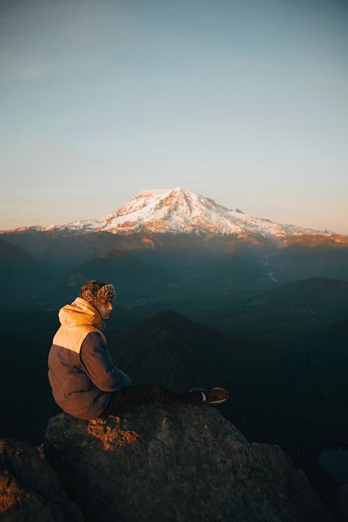 Man Sitting on Cliff