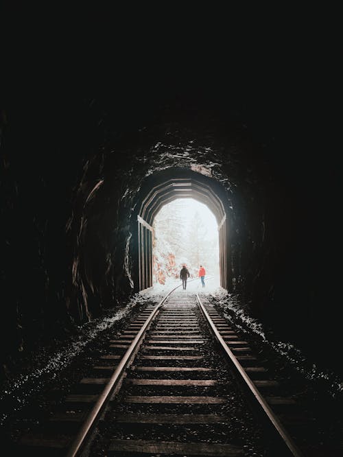 Railroad in dark tunnel in winter