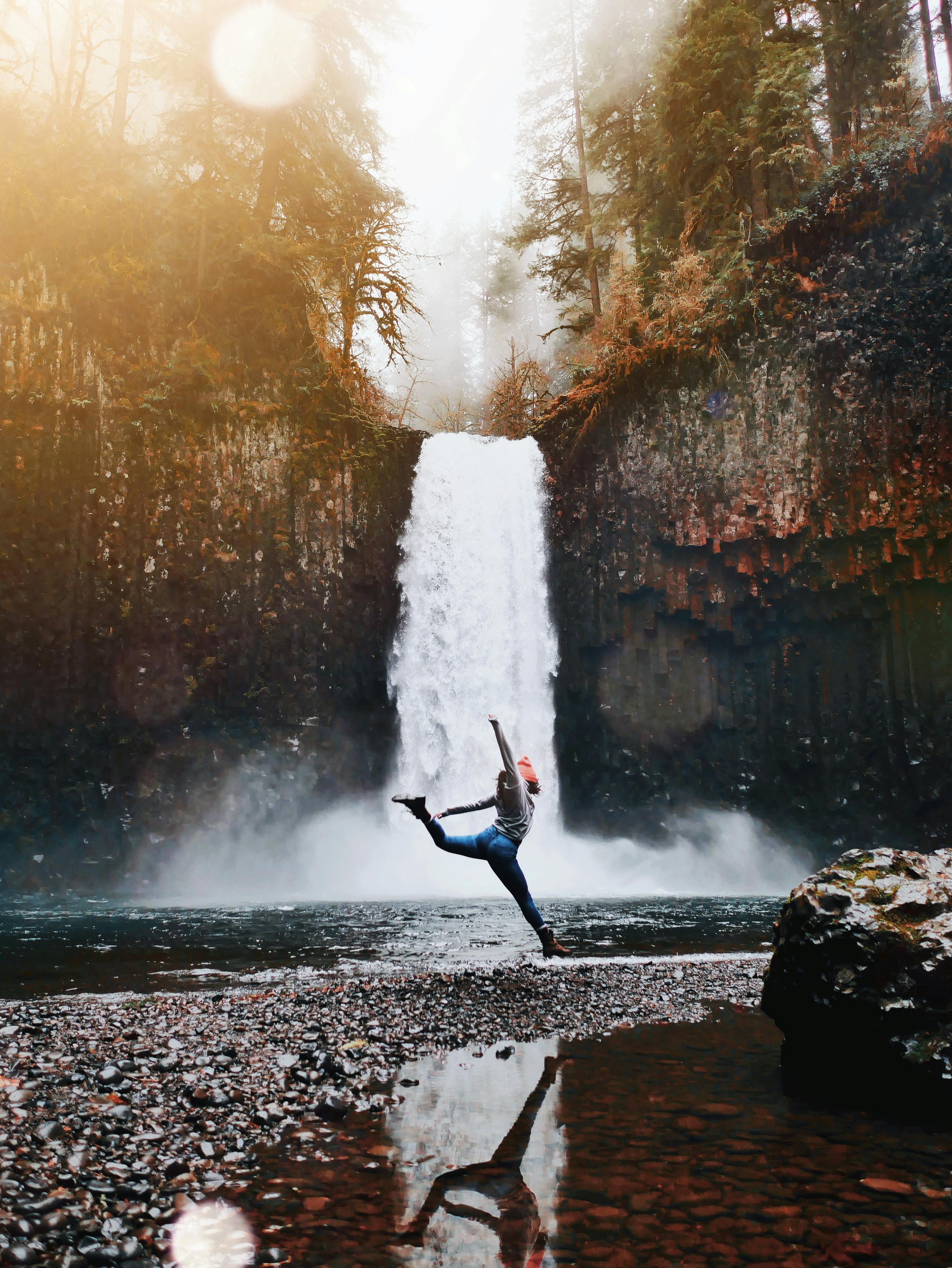 Man Meditating In Yoga Pose On Rocky Outcropping Next To Waterfall Photo  Background And Picture For Free Download - Pngtree