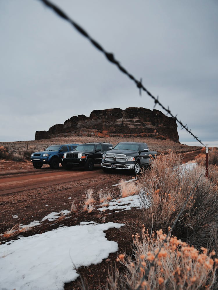 Modern Off Road Vehicles In Desert Valley