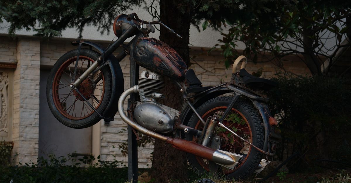 Spring Over Tree Motorcycle Rusty Vintage Motorcycle Under Tree Outdoors · Free Stock Photo