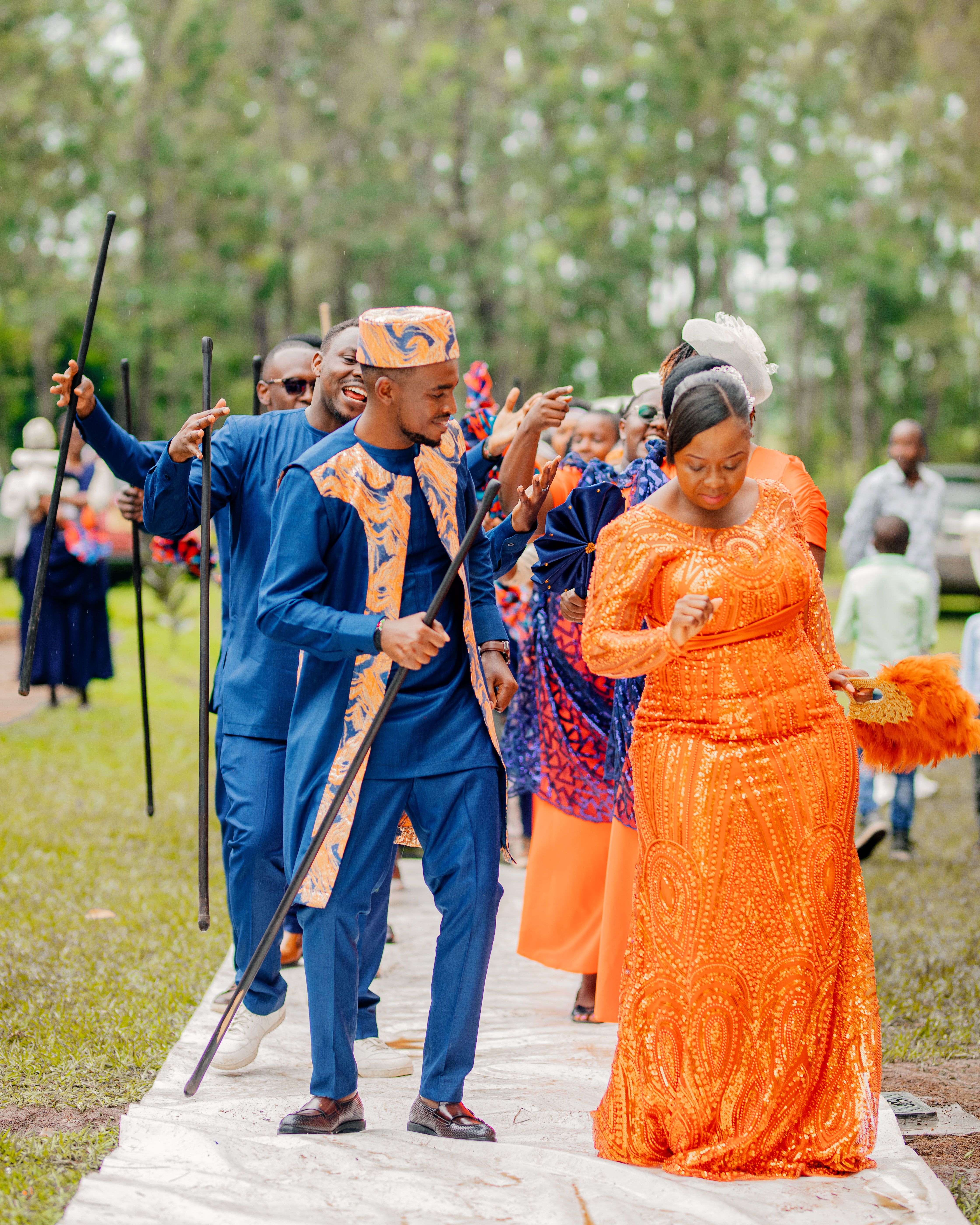 Joyful African traditional wedding procession in a garden