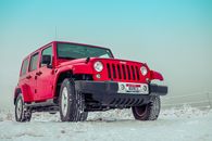 Red Suv on Snow Covered Ground